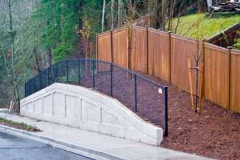 Image 1 of concrete foam insert style retaining wall installed by Foundation Specialists concrete contractor in Washington State